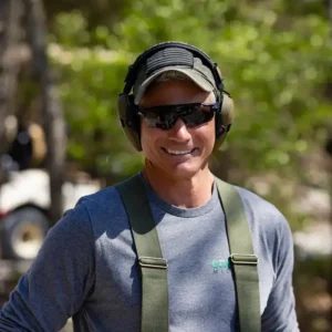 Participant at a Warriors’ Ascent clay shoot fundraiser wearing hearing protection, representing community support for veteran and first responder mental health programs